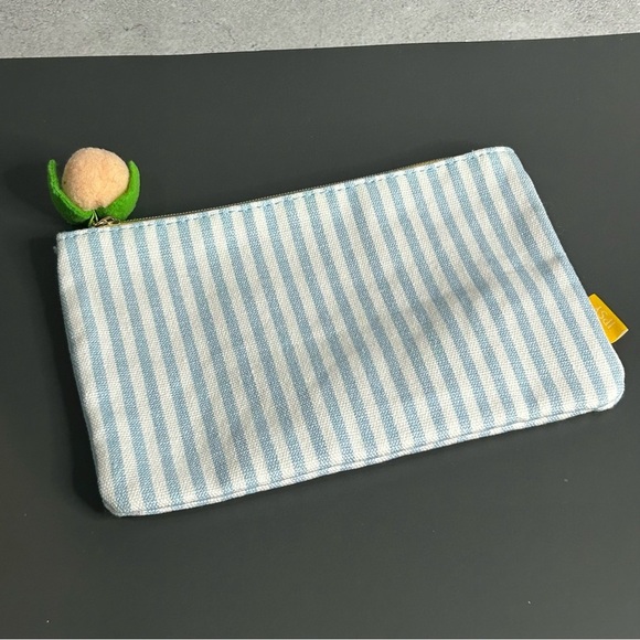 ipsy Handbags - ipsy Blue and White Striped Cosmetic Bag with Peach Accent